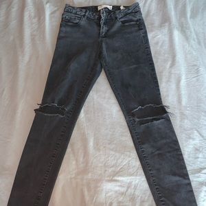 Black ripped knee skinny jeans